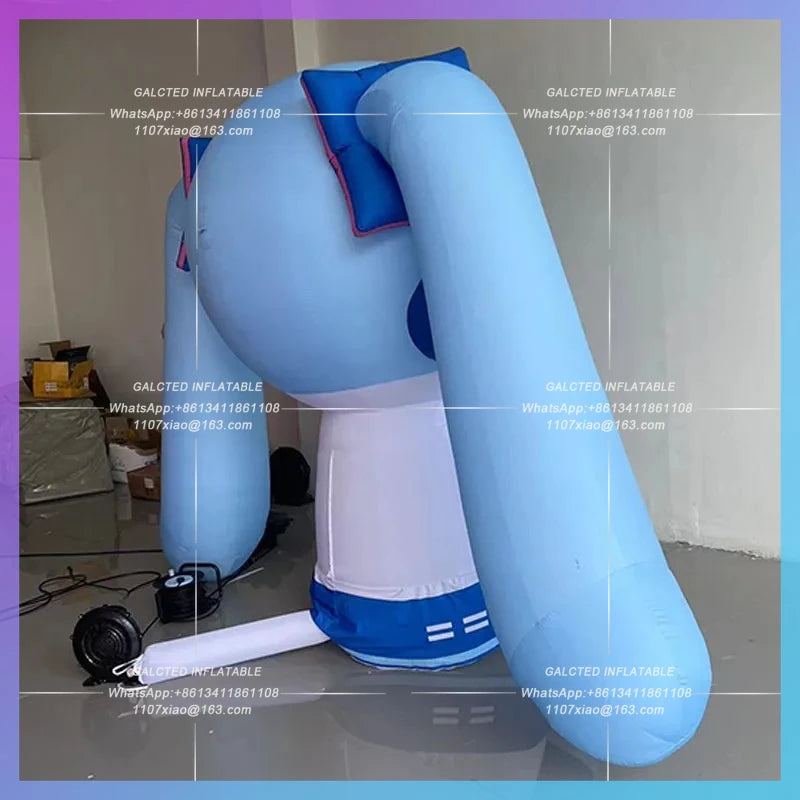 blue long hair double ponytail Inflatable seated blue anime girl model concert stage ambience lighting arrangement